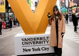 TOW_StephanieBurset.jpg Stephanie Burset stands next to a giant V for Vanderbilt University in what looks like Times Square.