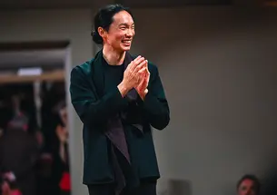 TOW_LelandKo20.jpg Leland Ko ’20 walks while clapping his hands.