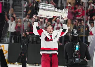 USATSI_29199630.jpg Eric Robinson ’18 raises the Stanley Cup after the Carolina Hurricanes beat the Vegas Golden Knights in six games.