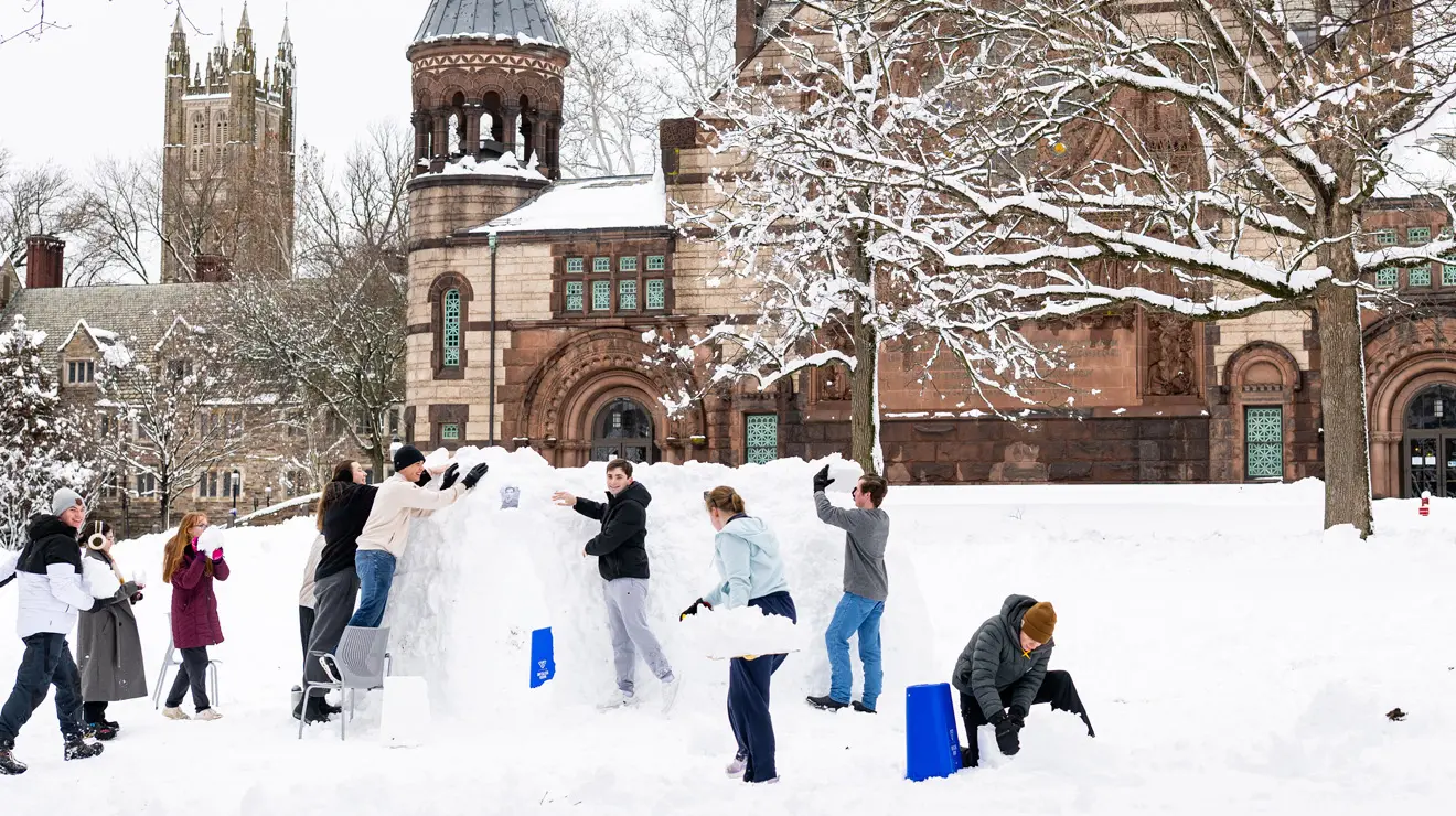 BLIZZARD_Igloo.jpg Students build a snow structure behind Alexander Hall