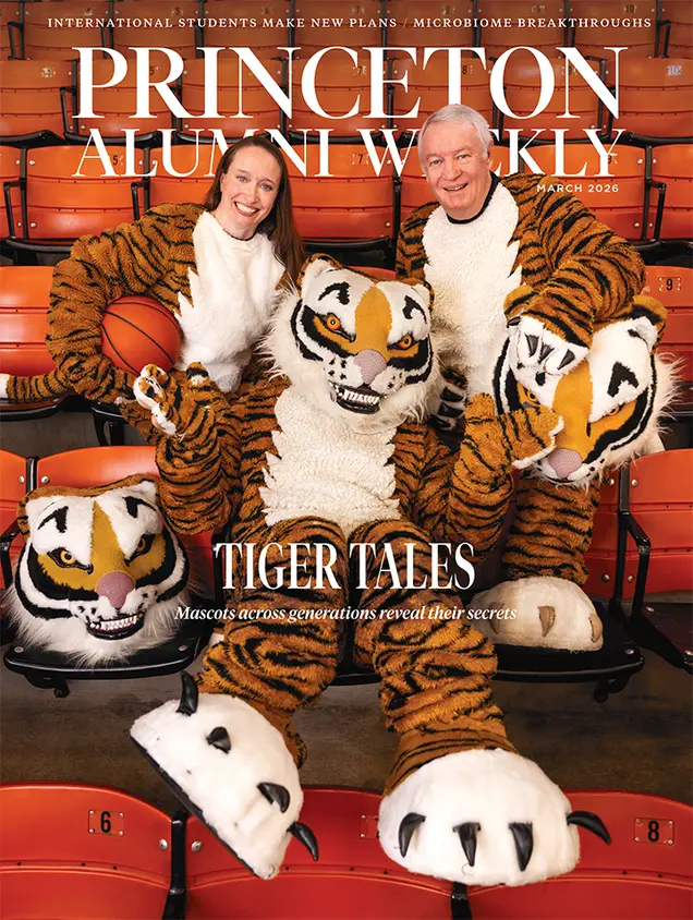 March2026_cover.jpg Three people in tiger mascot costumes sit on orange stadium seats.